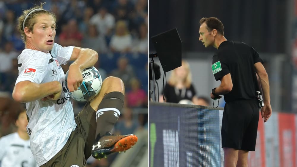 Daniel Buballa springt der Ball an den Arm, Referee Bastian Dankert überprüft die Szene